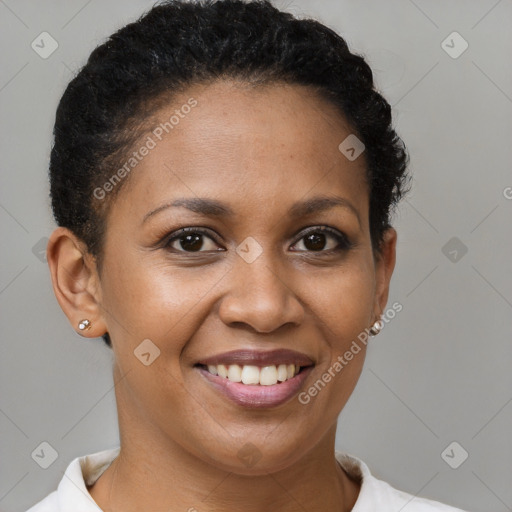 Joyful black young-adult female with short  brown hair and brown eyes