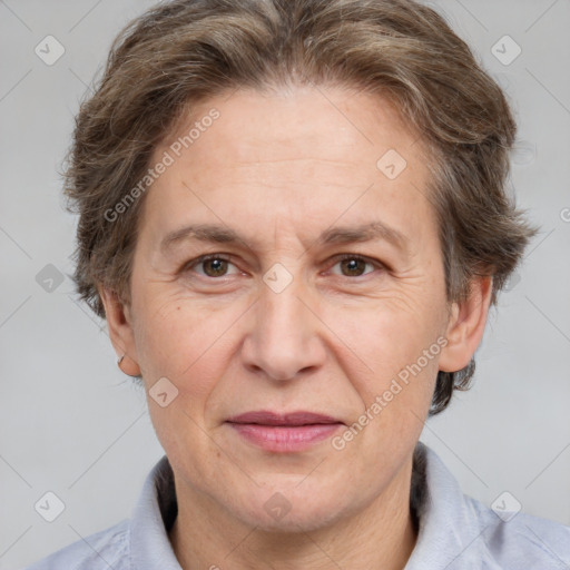 Joyful white adult female with short  brown hair and brown eyes