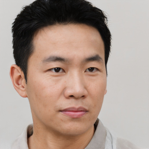 Neutral asian young-adult male with short  black hair and brown eyes