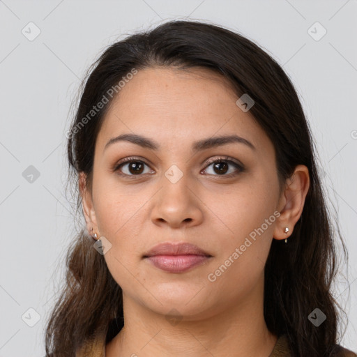 Joyful latino young-adult female with long  brown hair and brown eyes