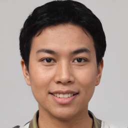 Joyful asian young-adult male with short  brown hair and brown eyes