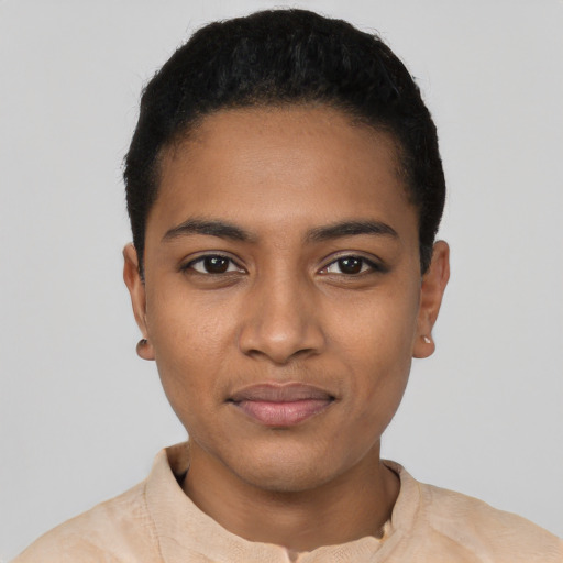 Joyful black young-adult female with short  black hair and brown eyes