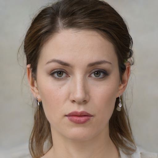 Neutral white young-adult female with medium  brown hair and green eyes