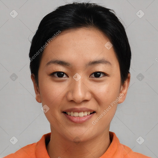 Joyful asian young-adult female with short  black hair and brown eyes