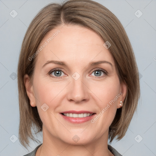 Joyful white adult female with medium  brown hair and grey eyes