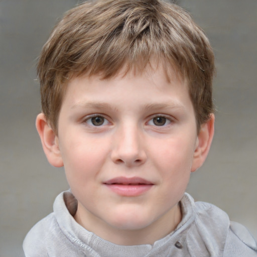 Joyful white child male with short  brown hair and grey eyes