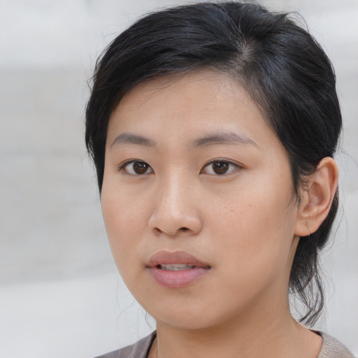 Neutral asian young-adult female with medium  brown hair and brown eyes