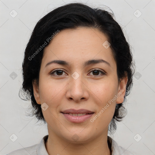 Joyful latino young-adult female with medium  brown hair and brown eyes