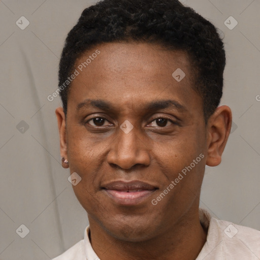 Joyful black adult male with short  black hair and brown eyes