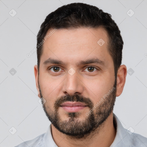 Neutral white young-adult male with short  black hair and brown eyes