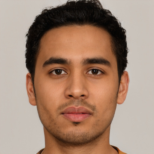 Neutral latino young-adult male with short  brown hair and brown eyes