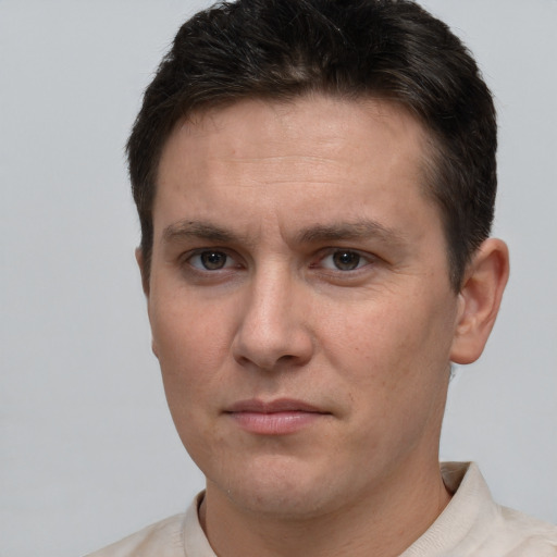 Neutral white young-adult male with short  brown hair and brown eyes