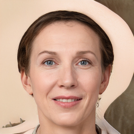 Joyful white adult female with short  brown hair and grey eyes