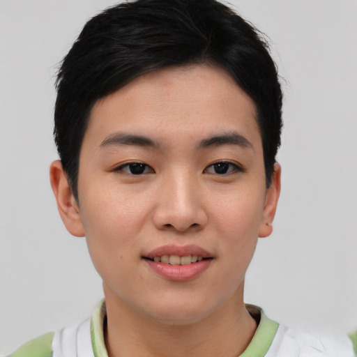 Joyful asian young-adult female with short  brown hair and brown eyes