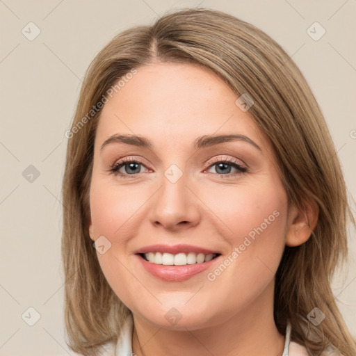 Joyful white young-adult female with medium  brown hair and green eyes