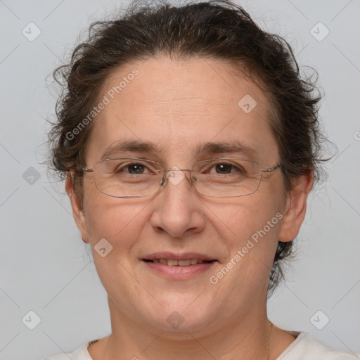 Joyful white adult female with short  brown hair and brown eyes