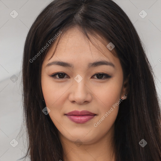 Joyful asian young-adult female with long  brown hair and brown eyes