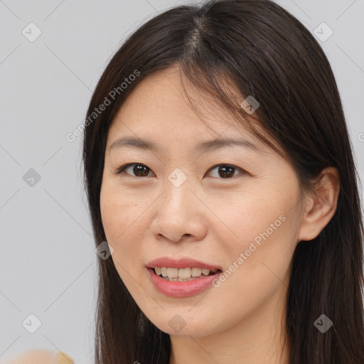 Joyful white young-adult female with long  brown hair and brown eyes