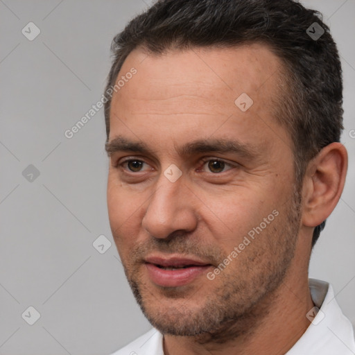 Joyful white adult male with short  brown hair and brown eyes