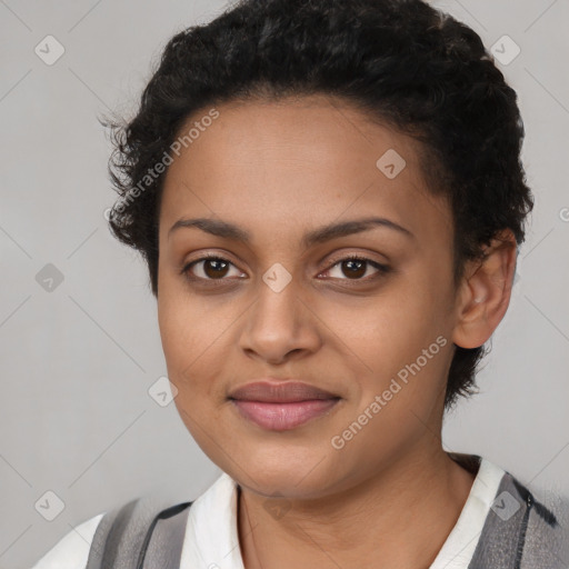 Joyful latino young-adult female with short  black hair and brown eyes