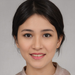 Joyful asian young-adult female with medium  brown hair and brown eyes