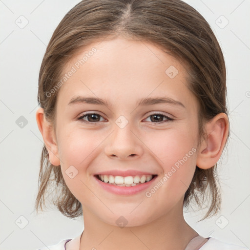 Joyful white child female with medium  brown hair and brown eyes