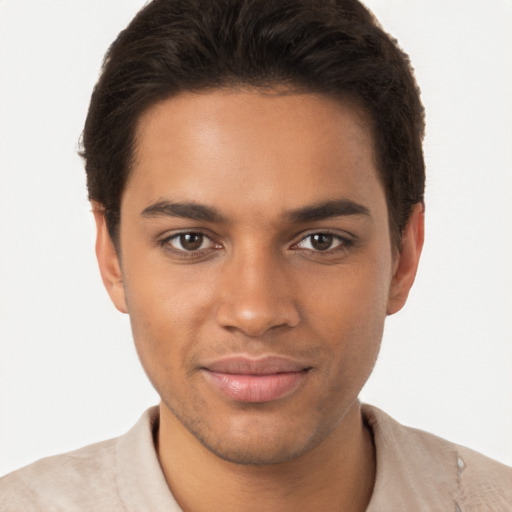 Joyful latino young-adult male with short  brown hair and brown eyes