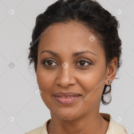 Joyful latino adult female with short  brown hair and brown eyes