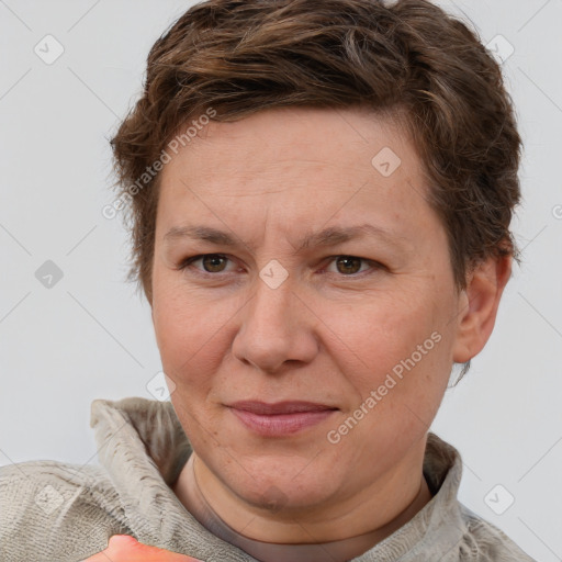 Joyful white adult female with short  brown hair and grey eyes