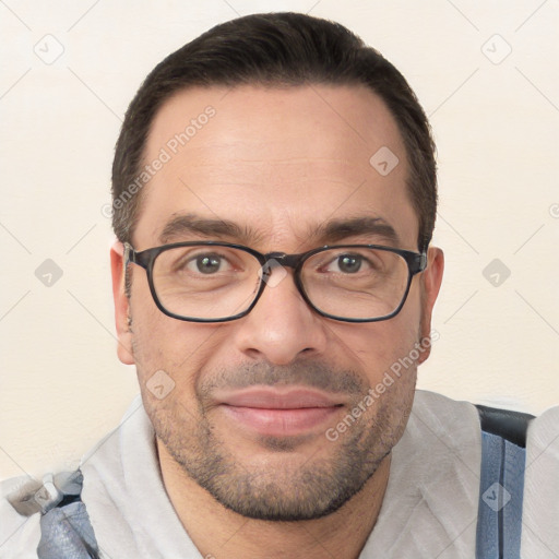 Joyful white adult male with short  brown hair and brown eyes