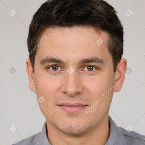 Joyful white young-adult male with short  brown hair and brown eyes