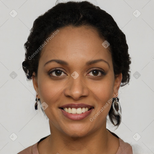 Joyful black young-adult female with short  black hair and brown eyes