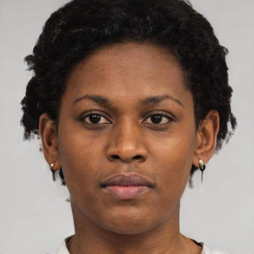 Neutral black young-adult female with short  brown hair and brown eyes