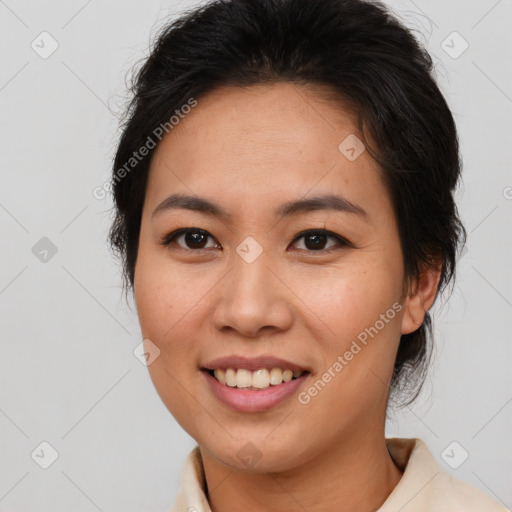 Joyful asian young-adult female with short  brown hair and brown eyes