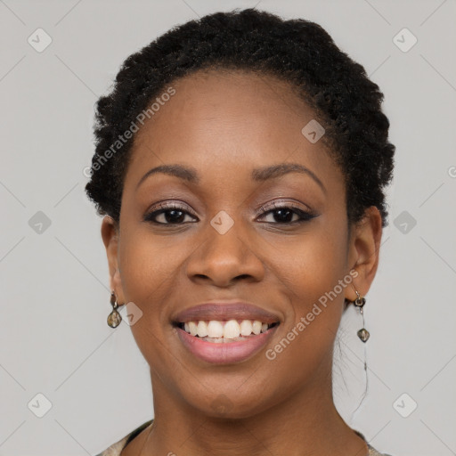 Joyful black young-adult female with short  brown hair and brown eyes