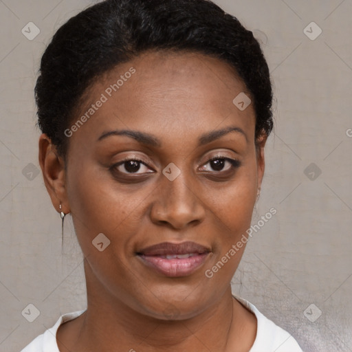 Joyful black young-adult female with short  brown hair and brown eyes