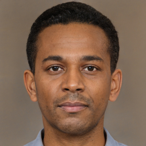 Neutral latino young-adult male with short  brown hair and brown eyes