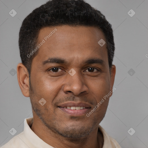 Joyful latino young-adult male with short  brown hair and brown eyes