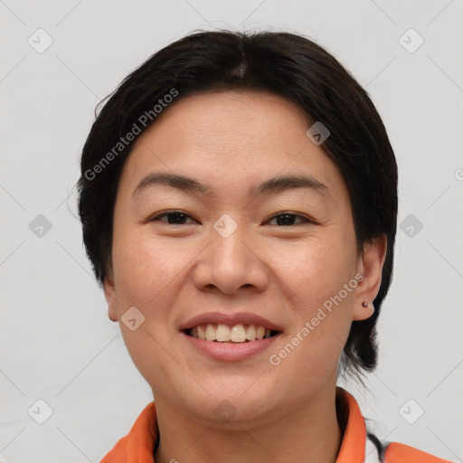Joyful asian young-adult female with short  brown hair and brown eyes