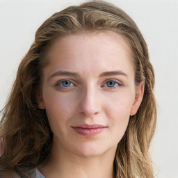 Joyful white young-adult female with long  brown hair and blue eyes