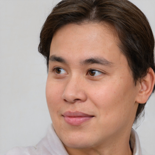 Joyful white young-adult male with medium  brown hair and brown eyes