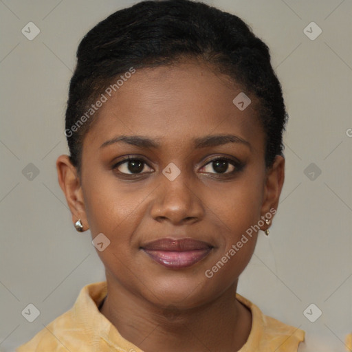 Joyful black young-adult female with short  brown hair and brown eyes