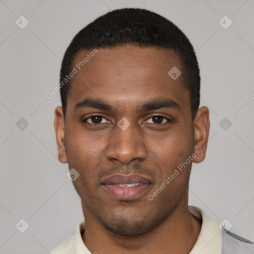 Joyful black young-adult male with short  black hair and brown eyes