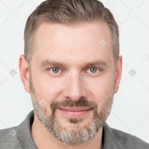 Joyful white adult male with short  brown hair and grey eyes