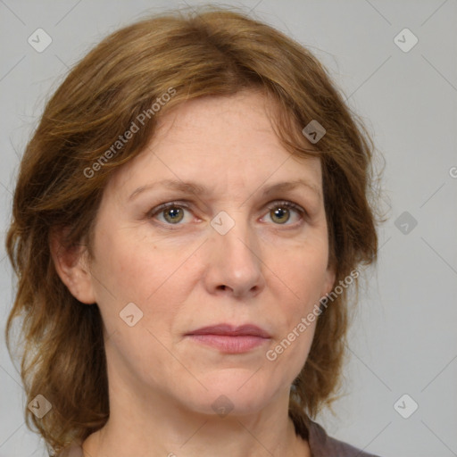 Joyful white adult female with medium  brown hair and grey eyes