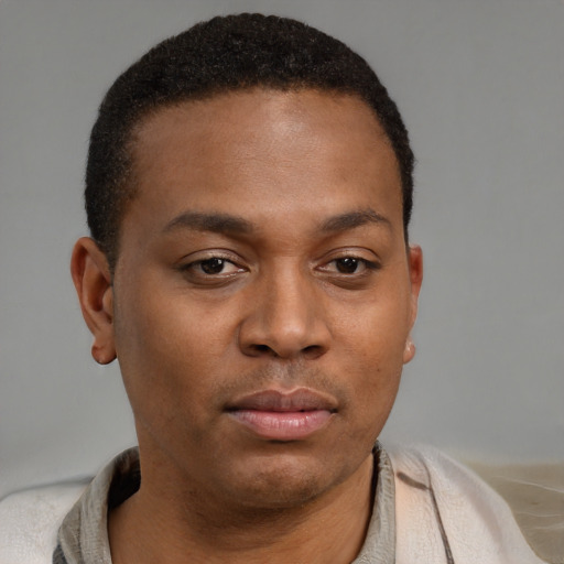 Neutral black young-adult male with short  brown hair and brown eyes