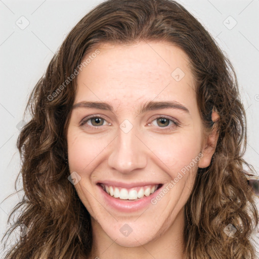 Joyful white young-adult female with long  brown hair and green eyes