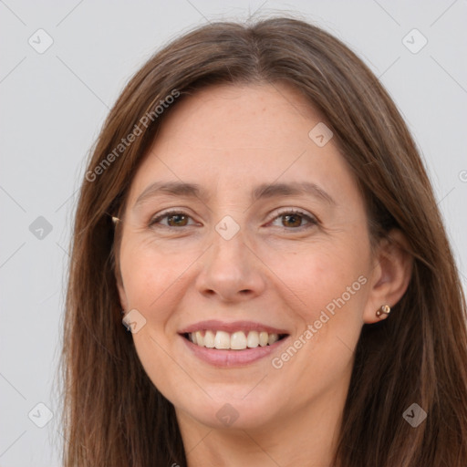 Joyful white adult female with long  brown hair and brown eyes