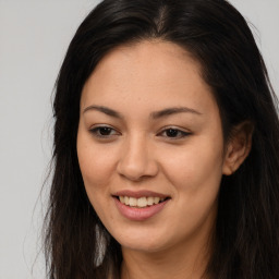 Joyful asian young-adult female with long  brown hair and brown eyes