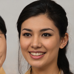 Joyful asian young-adult female with medium  brown hair and brown eyes